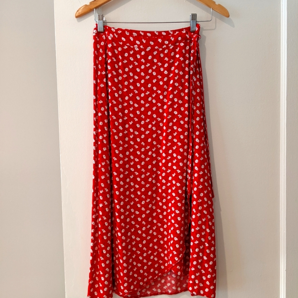 Red floral ditsy wrap midi skirt. Has a tie and button closures.